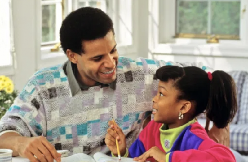 Father and daughter doing homework
