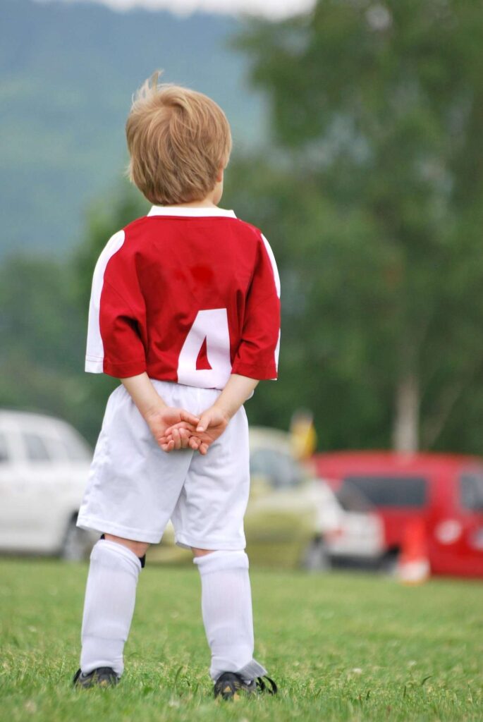 Young boy on soccer field - keeping sports safe for kids