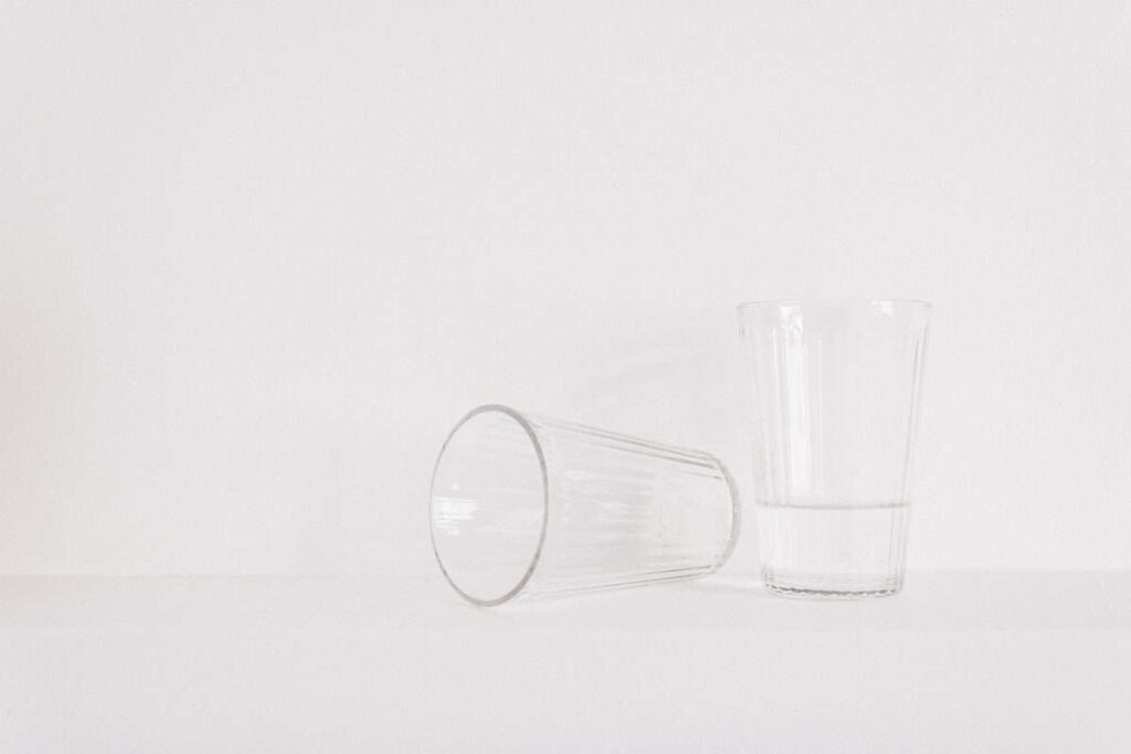 Two Clear Drinking Glasses on Table