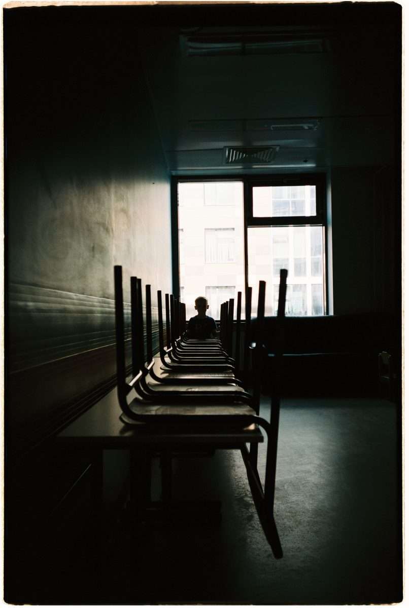 Silhouette of a Child Sitting at the Table
