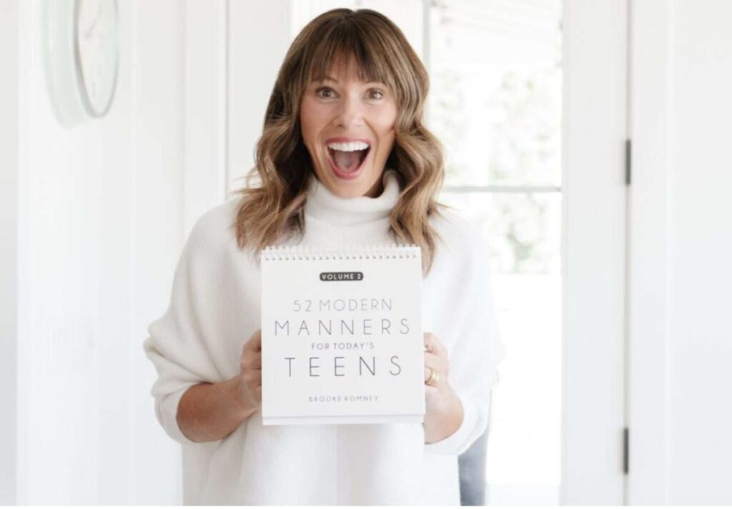 Romney, Brooke with book