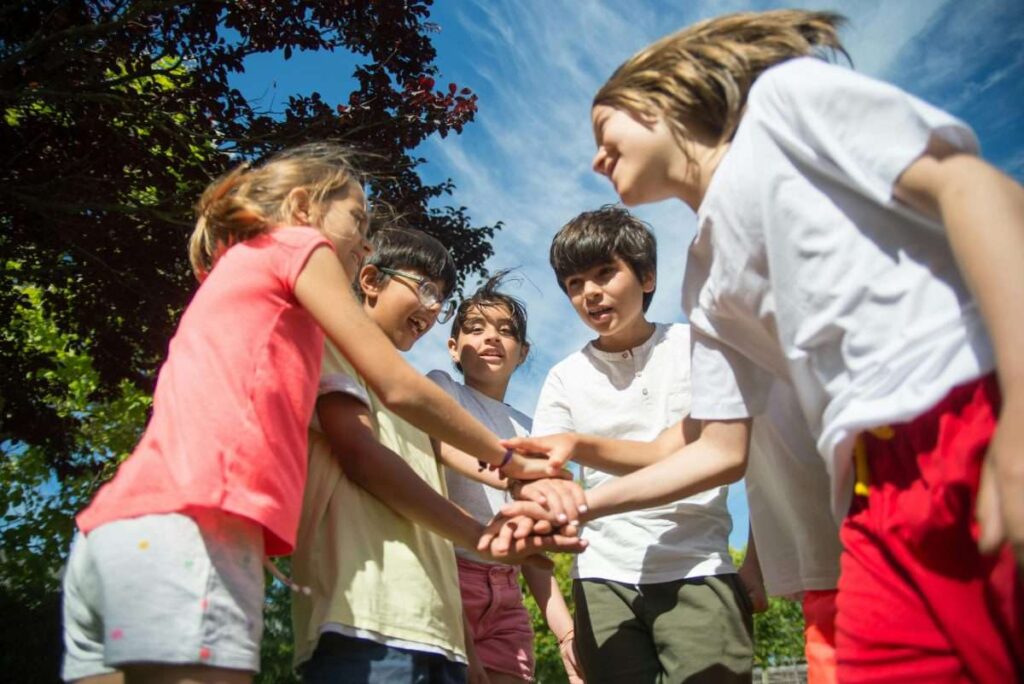 Kids in a circle playing.pexels-kampus-8813498