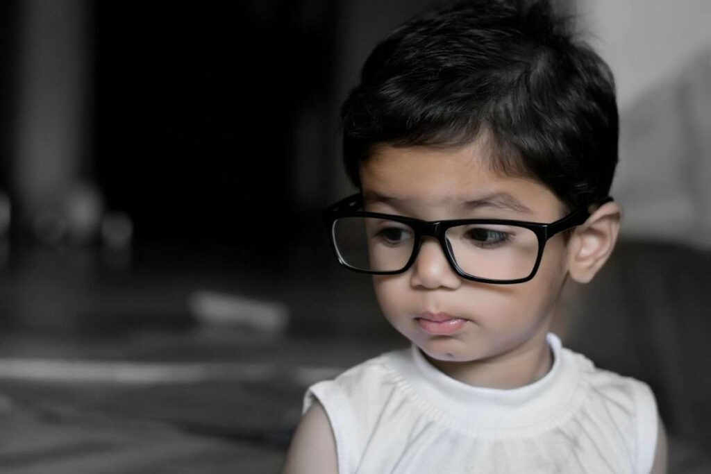 young child with glasses
