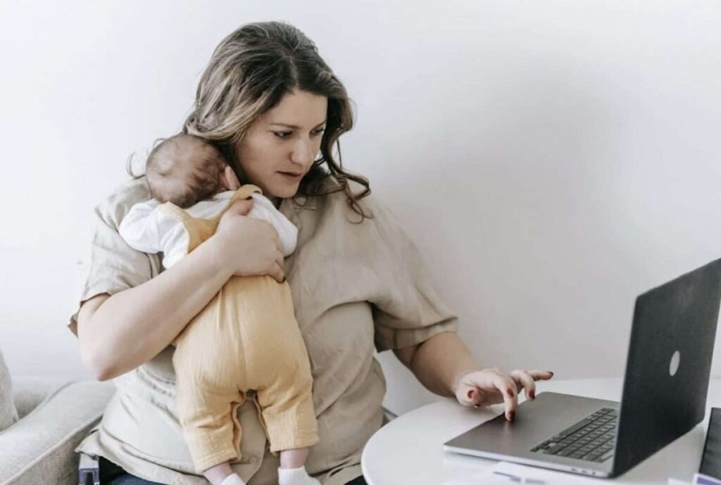 Mother and baby in front of laptop