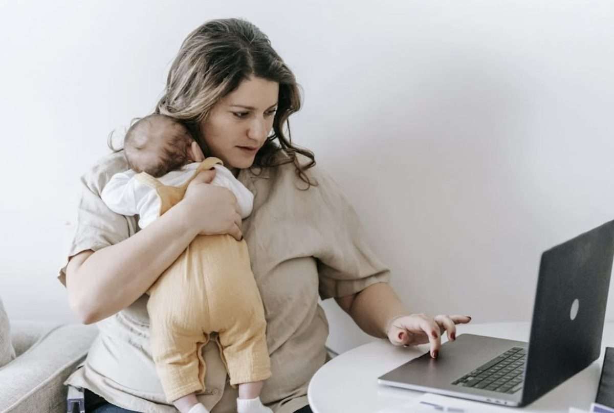 Mother and baby in front of laptop