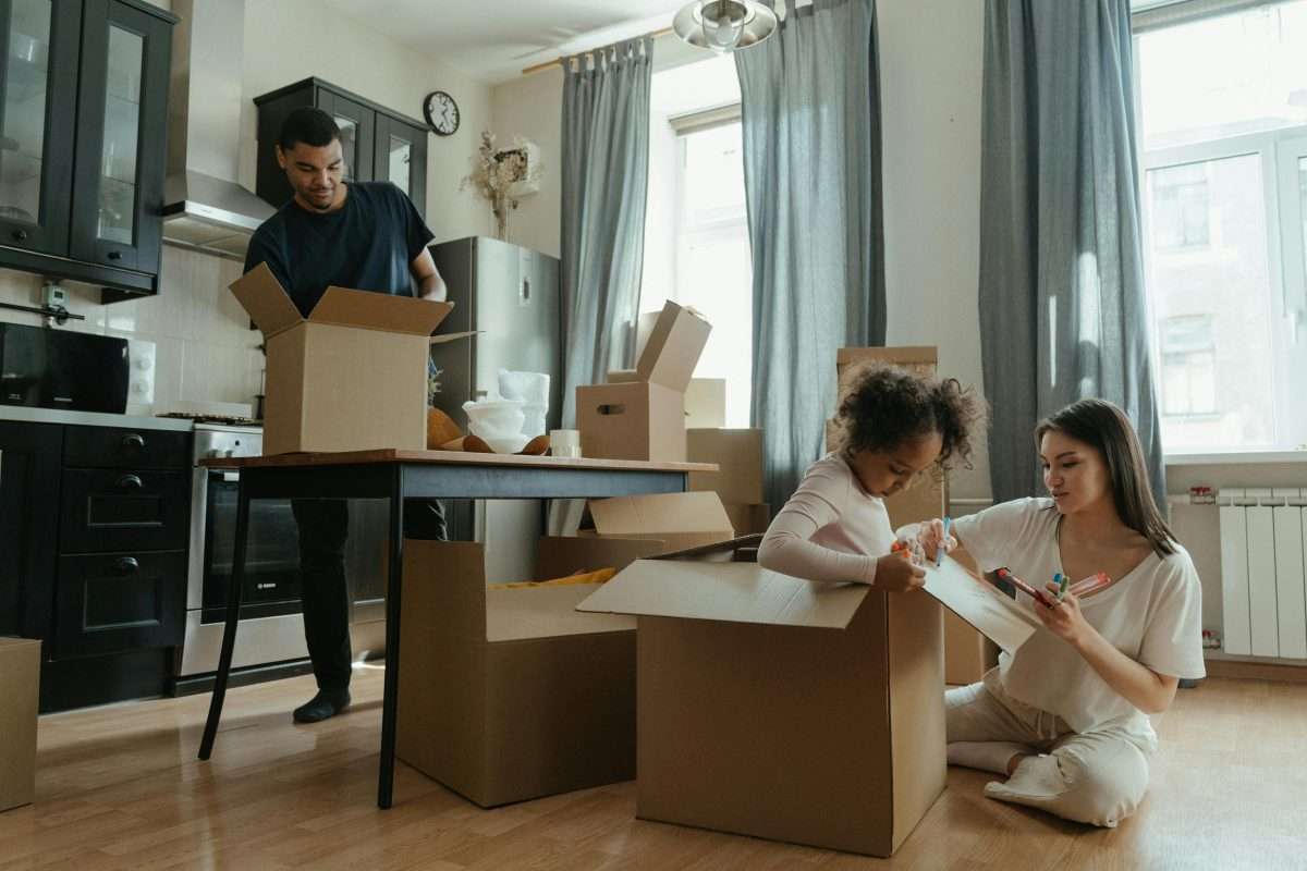 family packing moving boxes