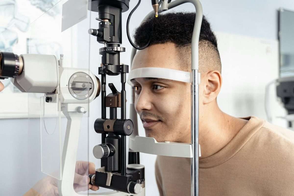 Male getting an eye test with machine