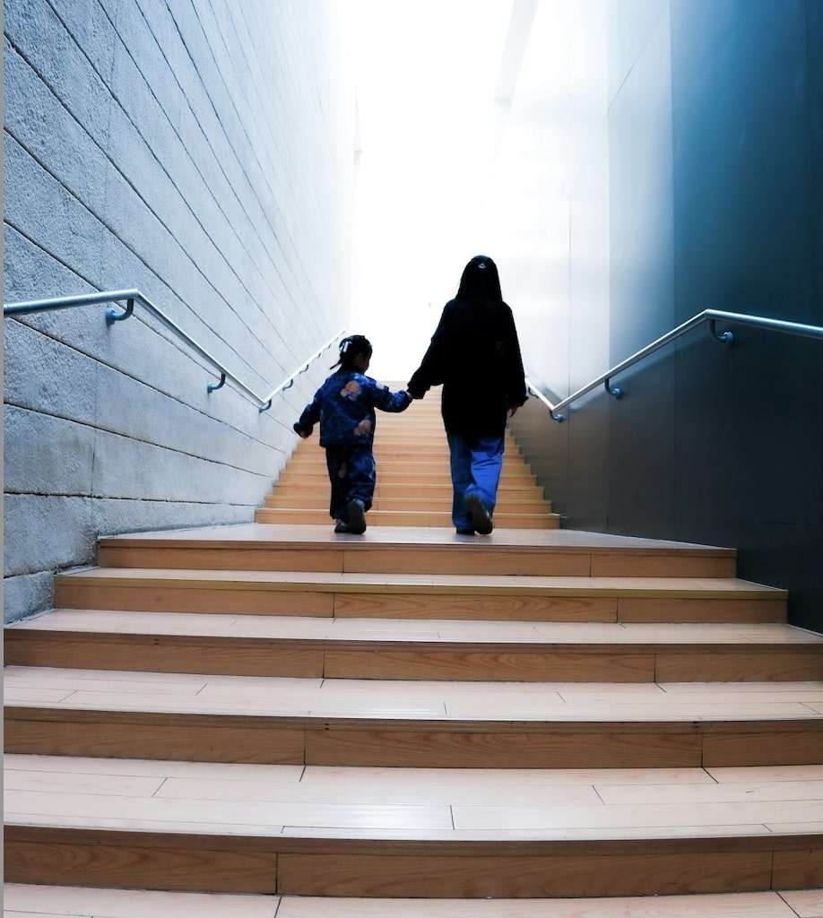 Mother and Boy walking up long stairs