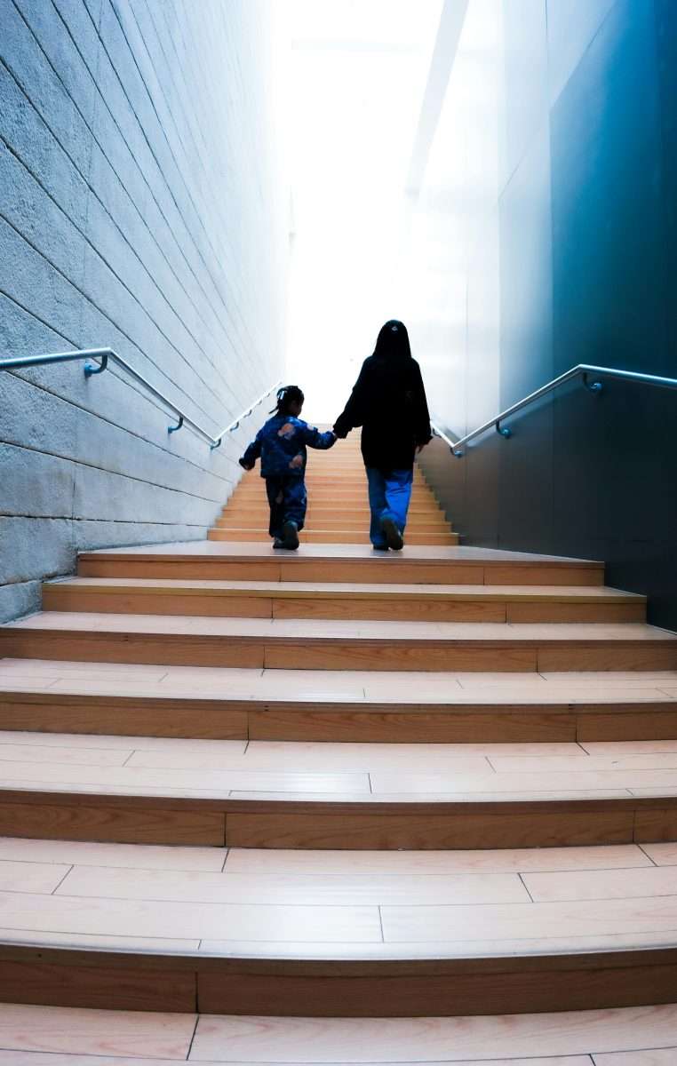 Mother and Child Ascending Modern Stairway