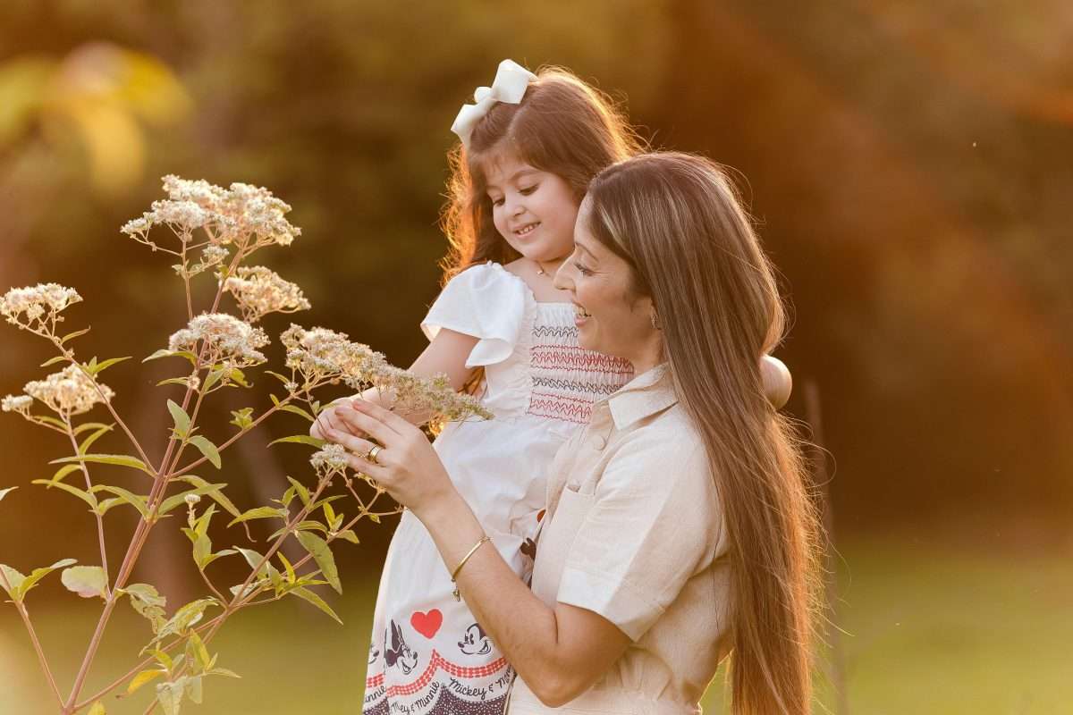Mother and Daughter Enjoying Nature at Sunset