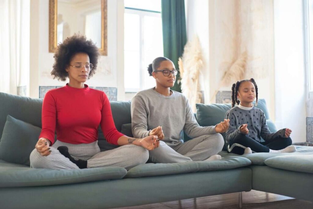 People Sitting on Sofa While Meditating