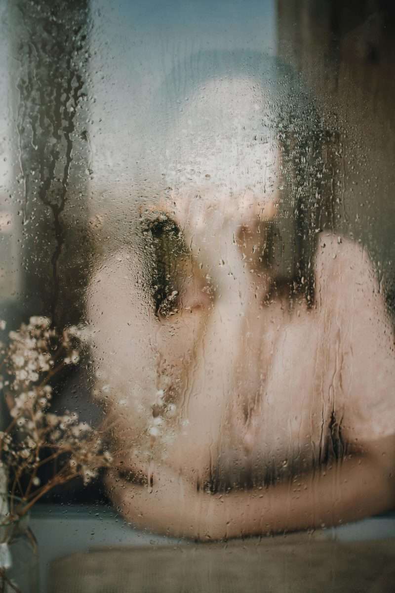 Woman Behind a a Glass Window