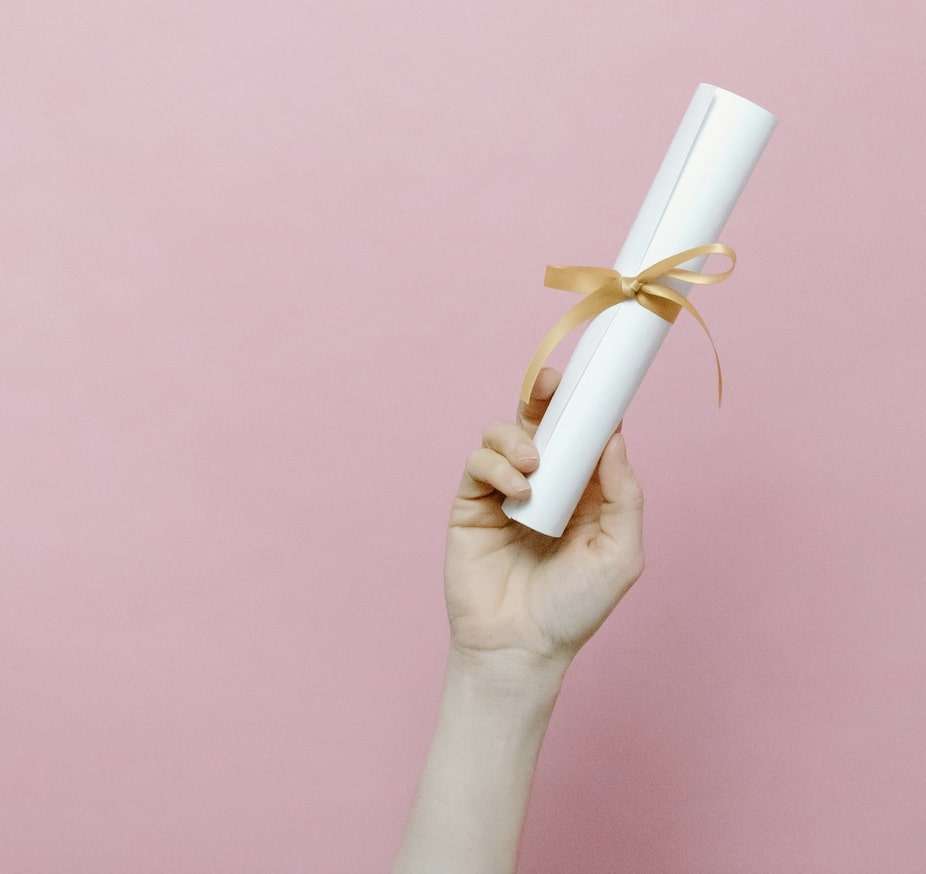 A Person Holding a Diploma