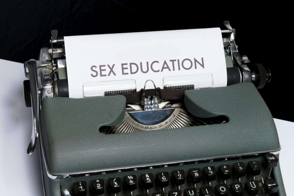 sex education typed on a paper inside an old typerwriter